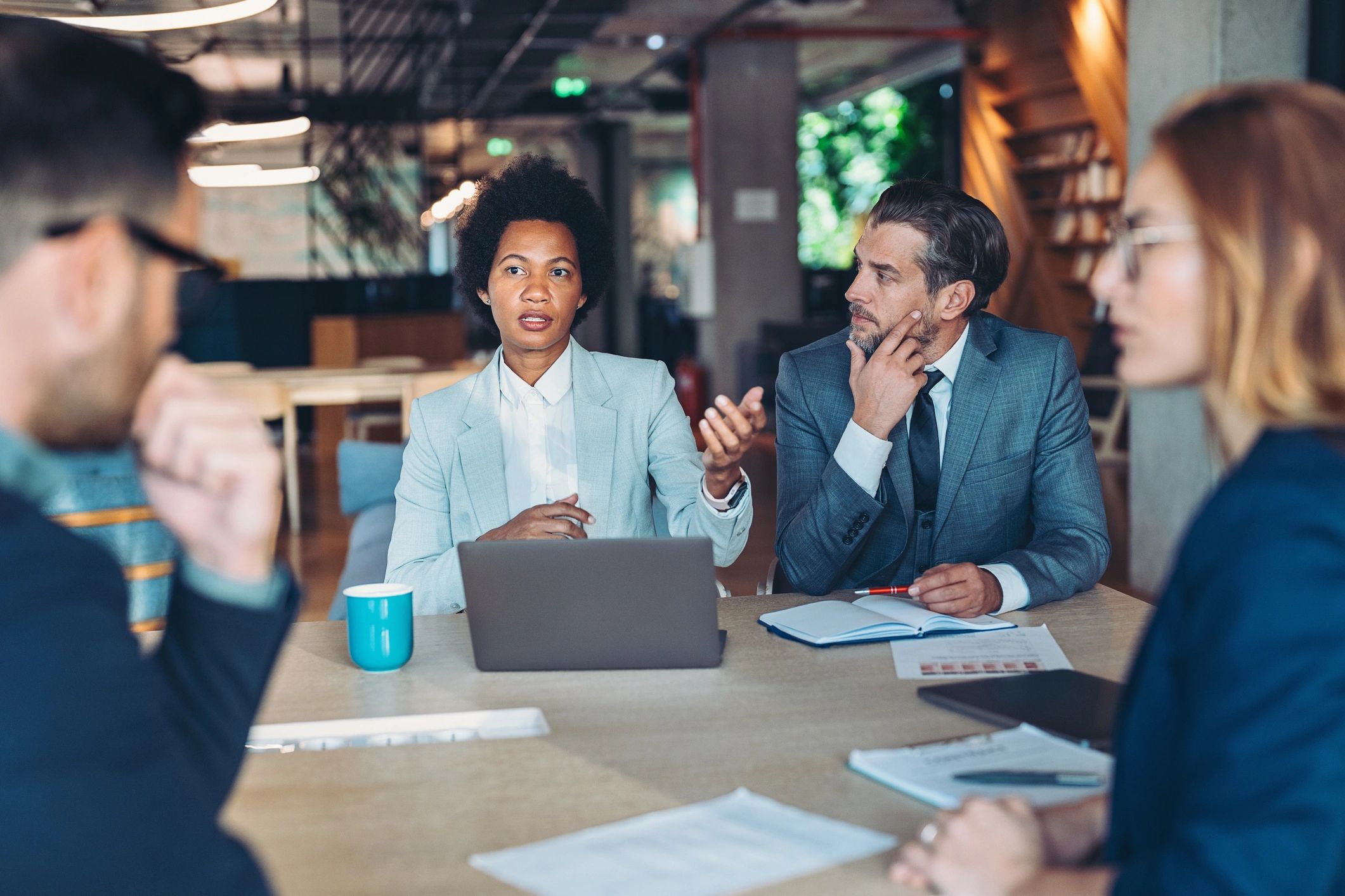 Professionals collaborating in a meeting to plan engagement and execution